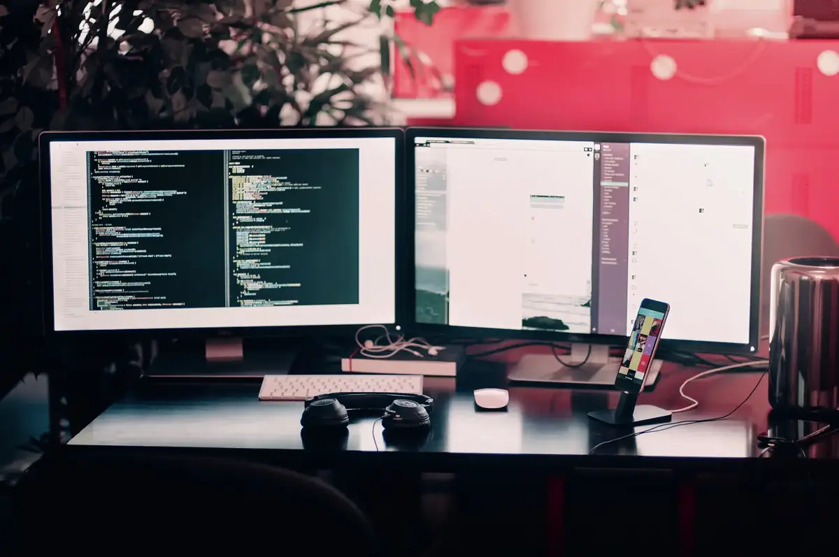 Developer workstation with code on two monitors
